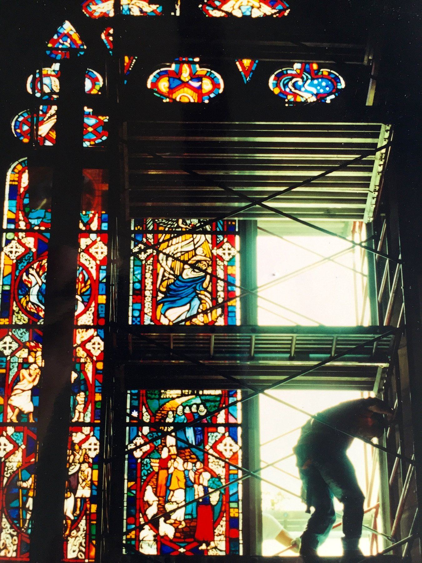 Stevan Stanisic on the scaffolding, installing the triptych stained glass windows of All Saints' Chapel, Sewanee, Tennessee
