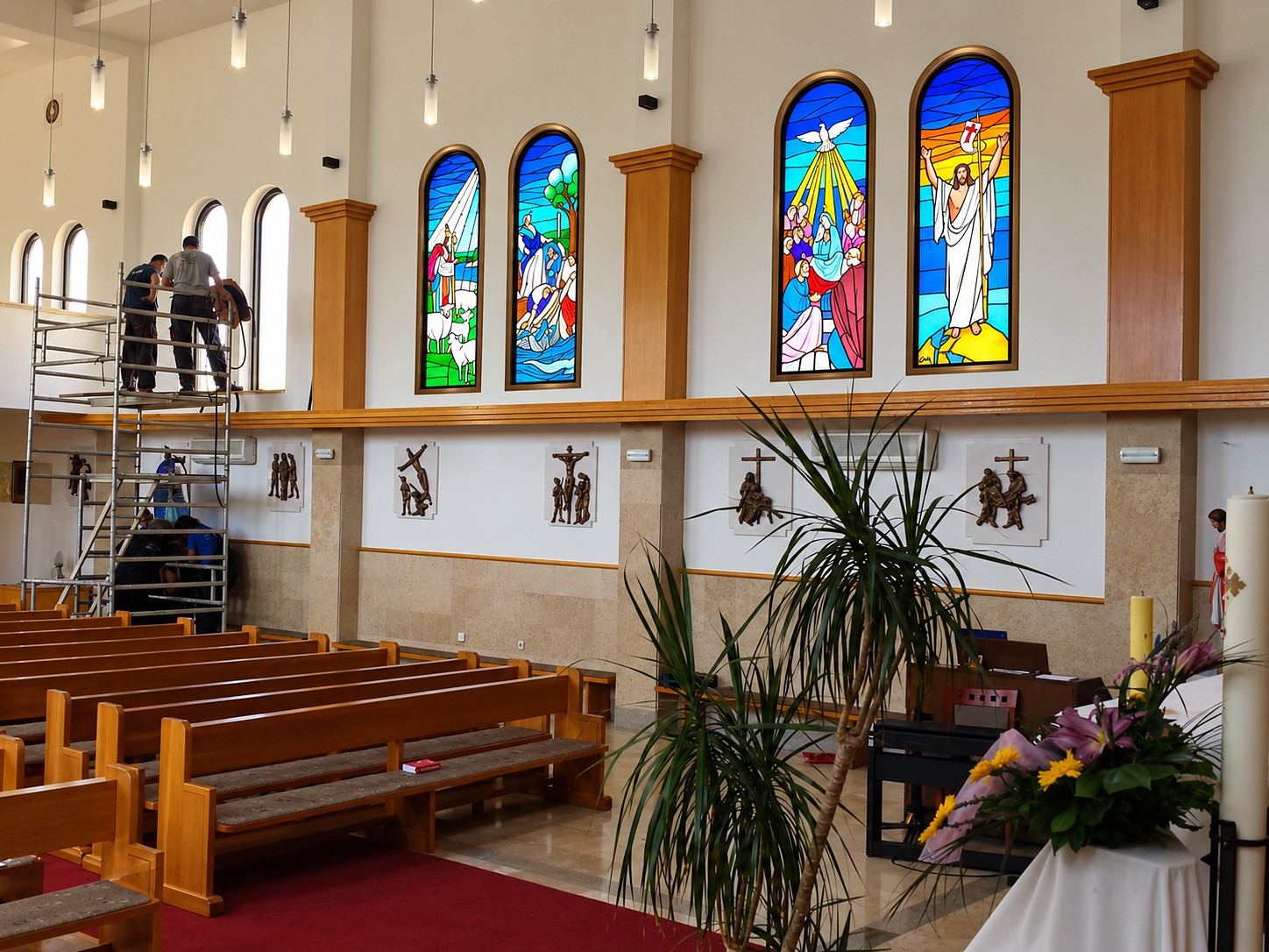 Installing the stained glass windows from a scaffold in the Church of the Sacred Heart in Čeljevo