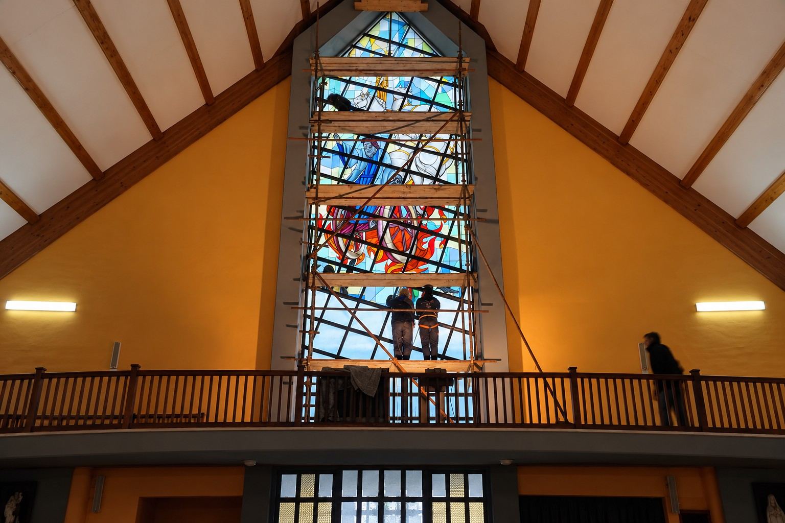 The scaffold over the choir loft of the church in Garevac during installation of the stained glass window