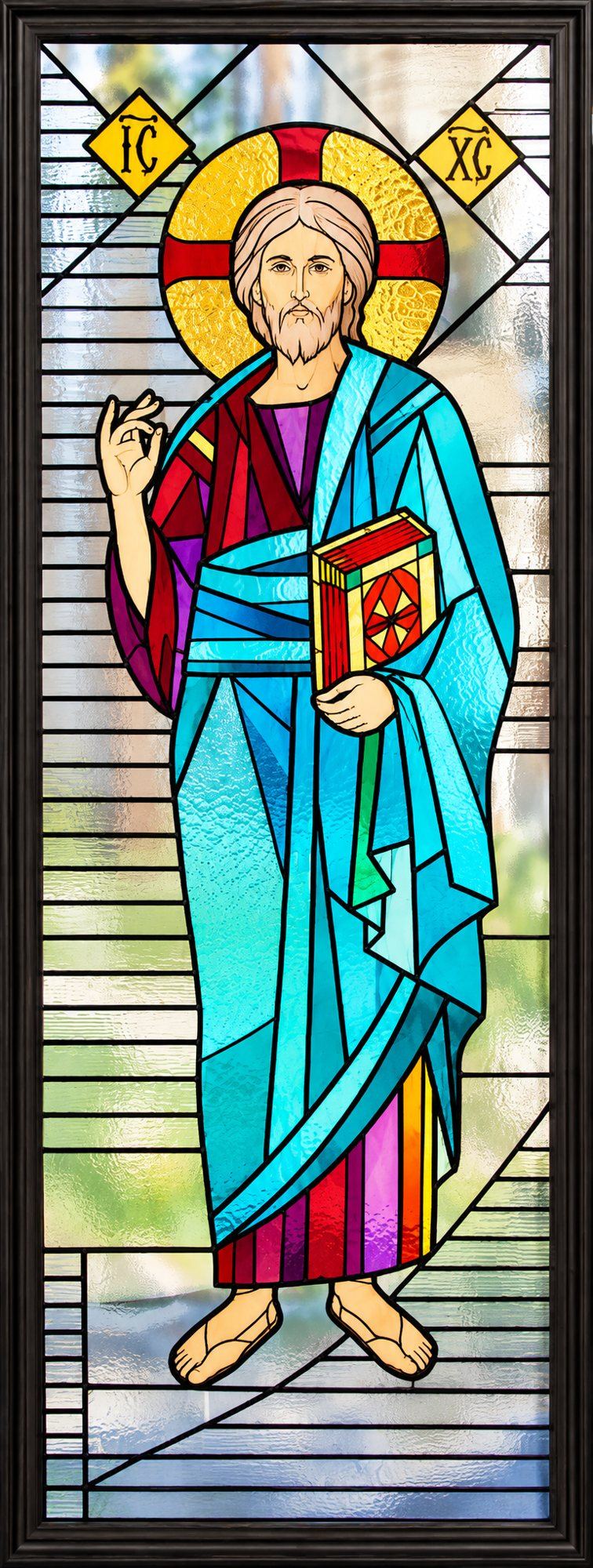 Stained glass window of Christ blessing, with the Gospel and the letters IC XC, Church of Saint Sava, Golija