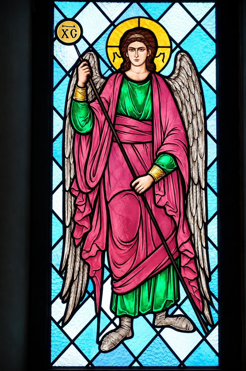 Stained glass window of an angel in a rose and green robe with a staff, Greek Catholic church in Mikluševci