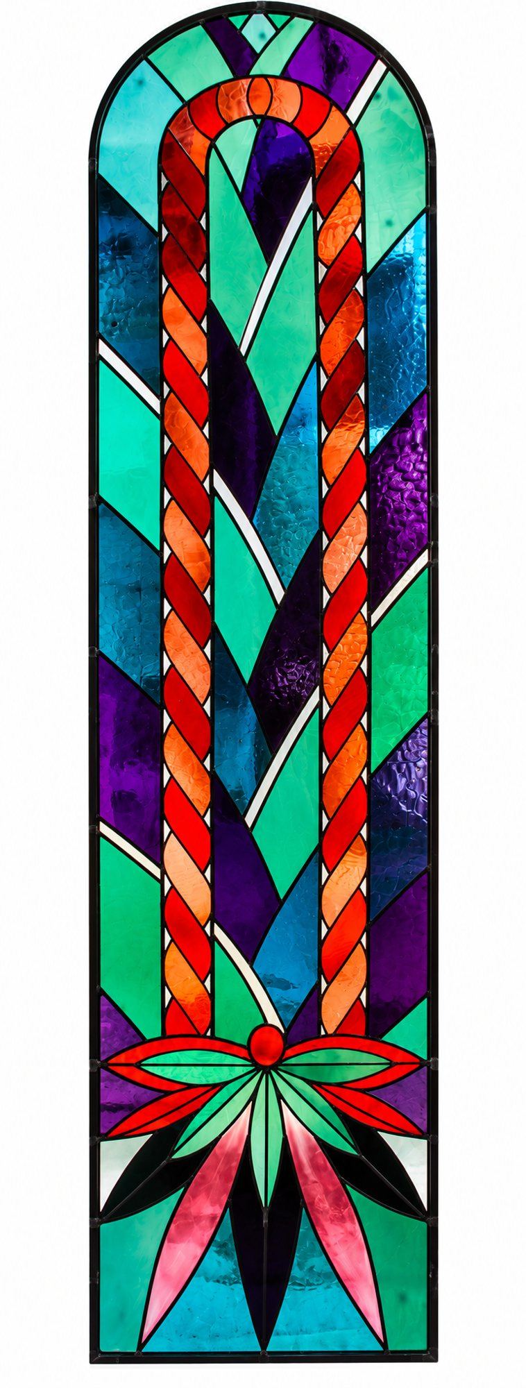 Arched stained glass window with a red and orange braid on green, turquoise and violet glass, chapel at Praskvica