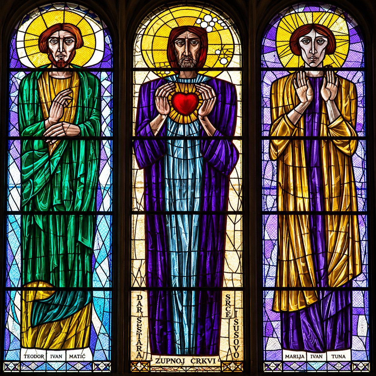Stained glass triptych of the Sacred Heart of Jesus between 2 saints, Saint Joseph, Sarajevo