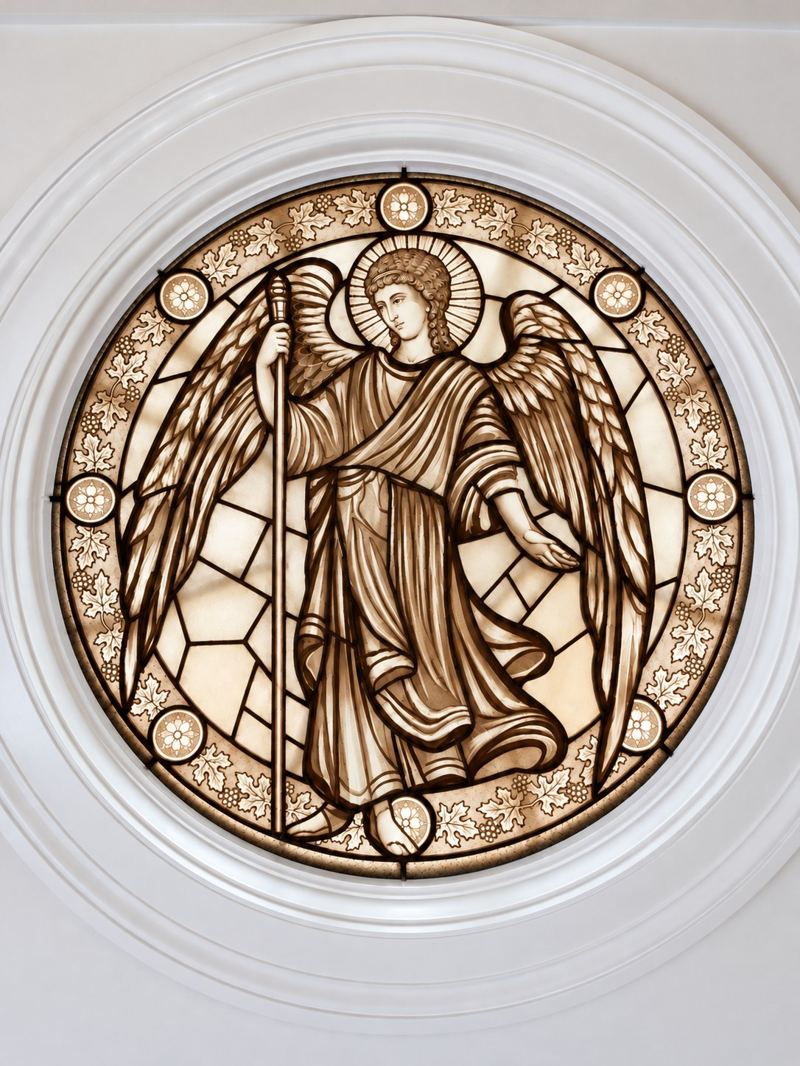 The Archangel Gabriel in sepia stained glass by Mila Apperlo, a round window in the Healing Chapel at Trinity by the Cove Episcopal Church, Naples, Florida