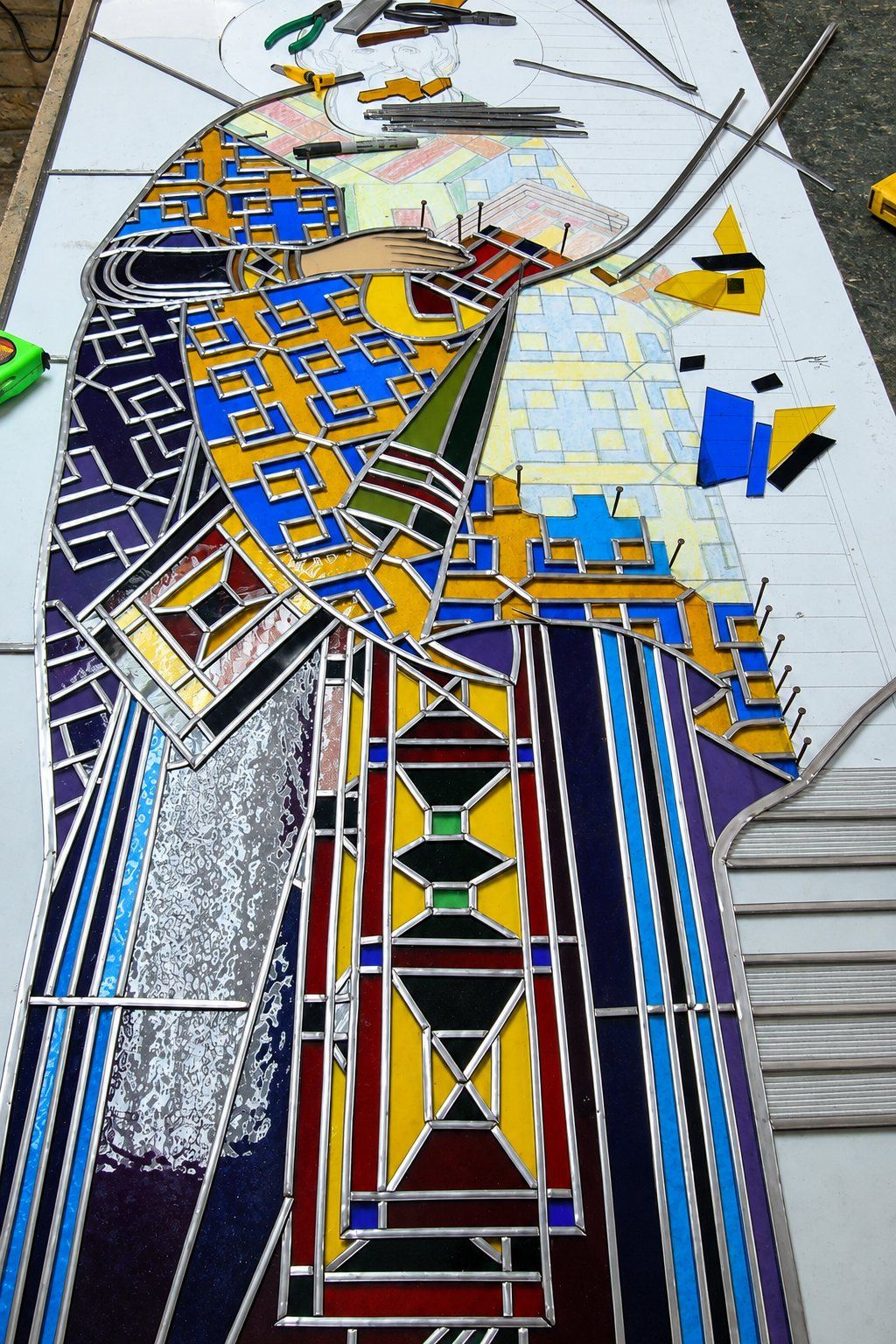 The vestments of Saint Sava taking shape in lead and glass on the workbench, Sombor