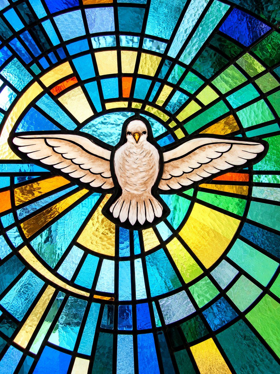 Stained glass window of the Holy Spirit as a white dove in a burst of light, Greek Catholic church in Mikluševci