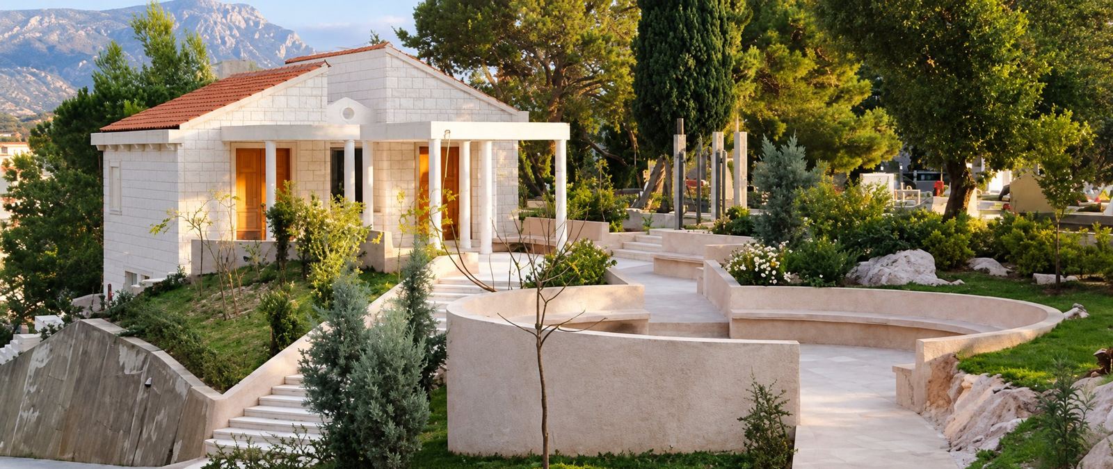 The City Chapel in Petrovac with its white columns and terraced garden, the mountains behind it