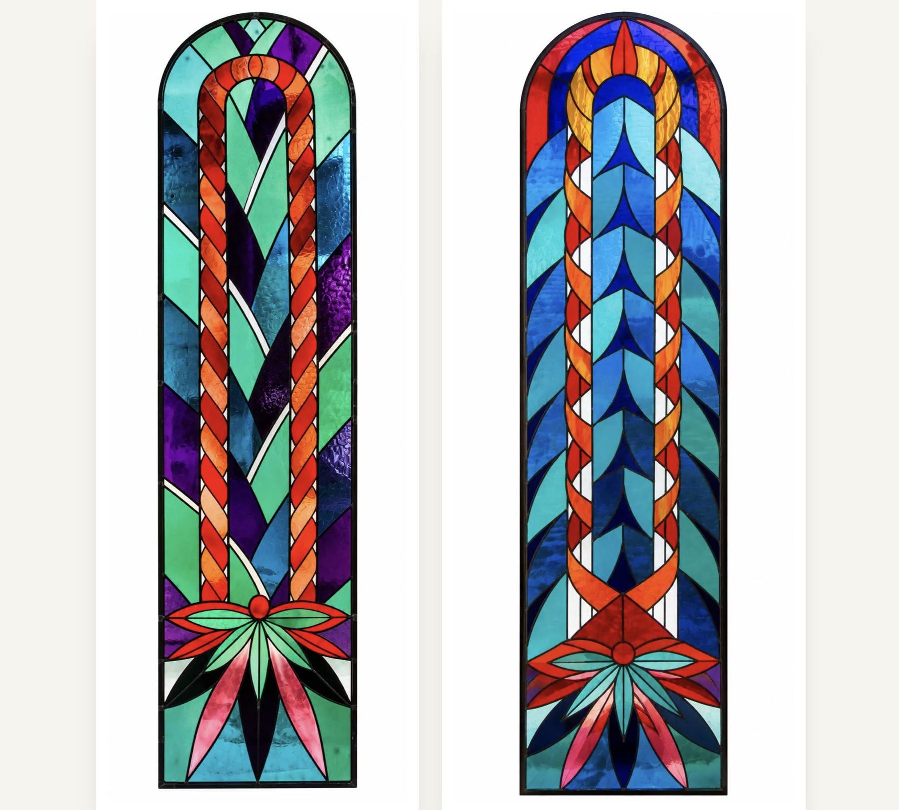 2 arched stained glass windows side by side, each with a braided ribbon of red and orange rising from a burst of leaves, one in green and violet and one in blue, chapel at Praskvica, Montenegro, by Stanisic Studio