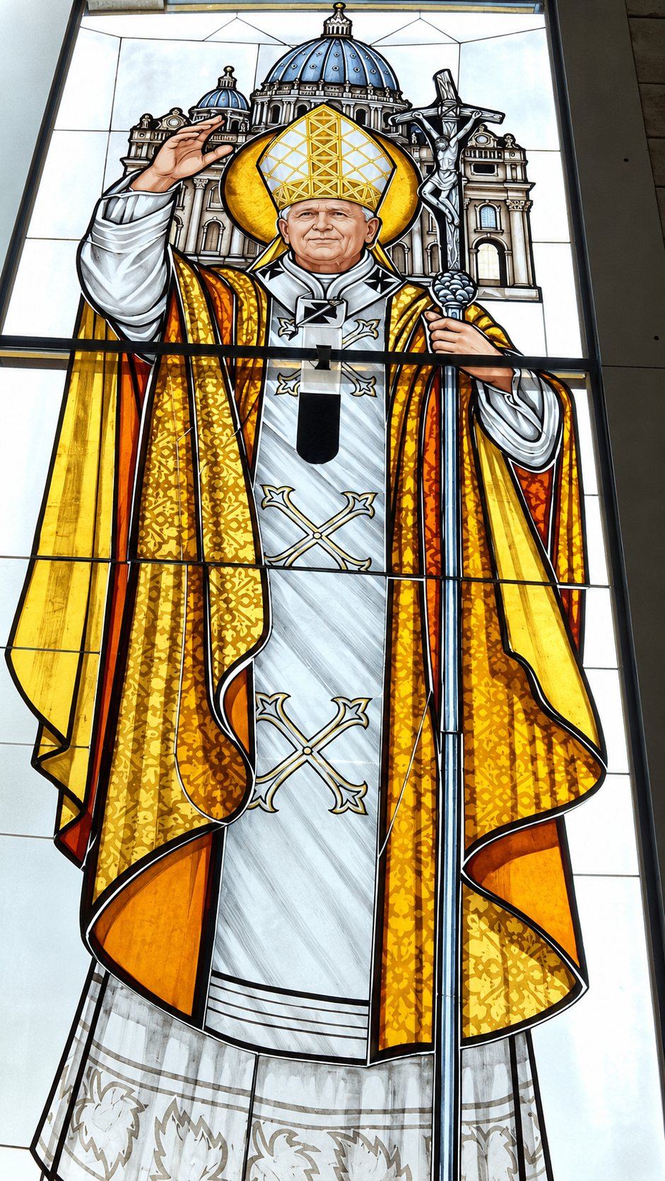 Detail of the stained glass window of Saint John Paul II, gold vestments, mitre and pastoral staff, Stolac