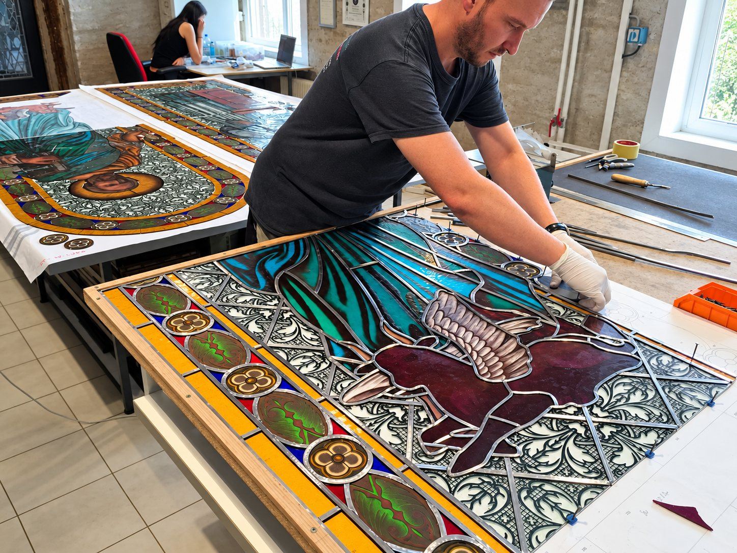 Leading the stained glass window of Saint Luke the Evangelist in the studio in Sombor, Serbia