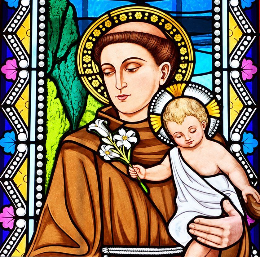 Stained glass detail of Saint Anthony of Padua in a brown Franciscan habit holding the Christ Child and a lily, Catholic Pastoral Centre in Tuzi, Montenegro, by Stanisic Studio