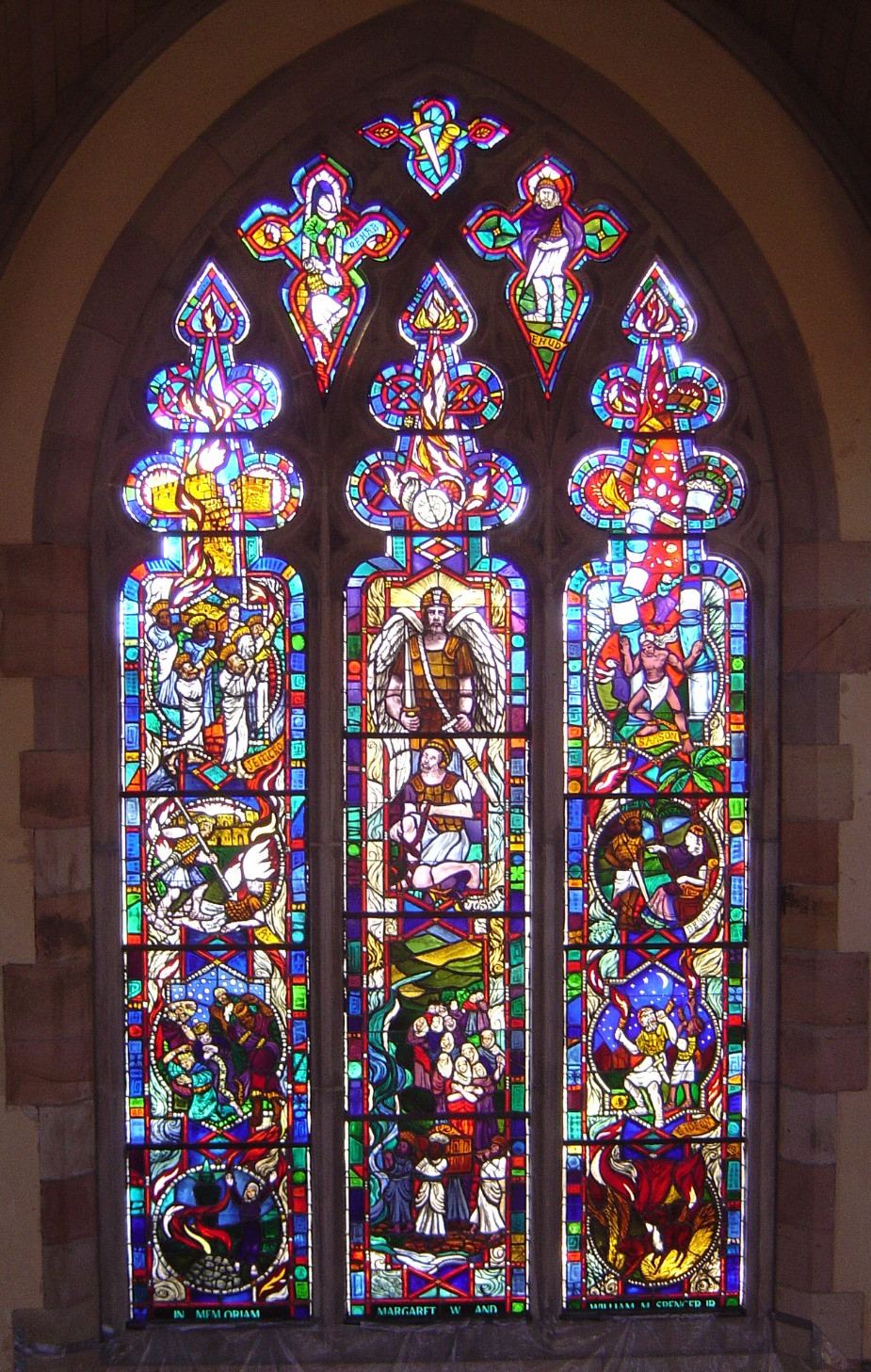 Stained glass triptych window at All Saints Chapel, University of the South in Sewanee, Tennessee